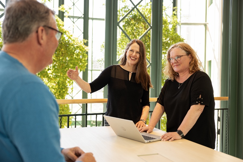 Optema consultants in conversation with a customer